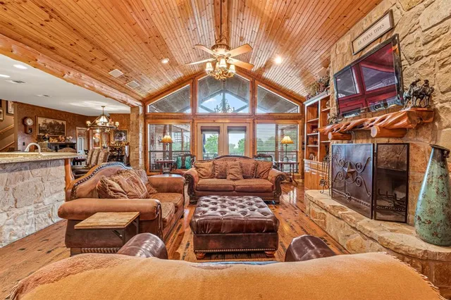 a outdoor living space with furniture and a fireplace