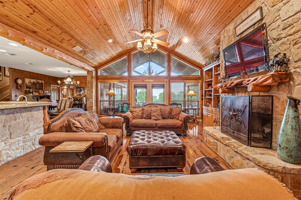 475 Magic Valley Bluff Dale, TX 76433 - Photo 6 of 40 a outdoor living space with furniture and a fireplace