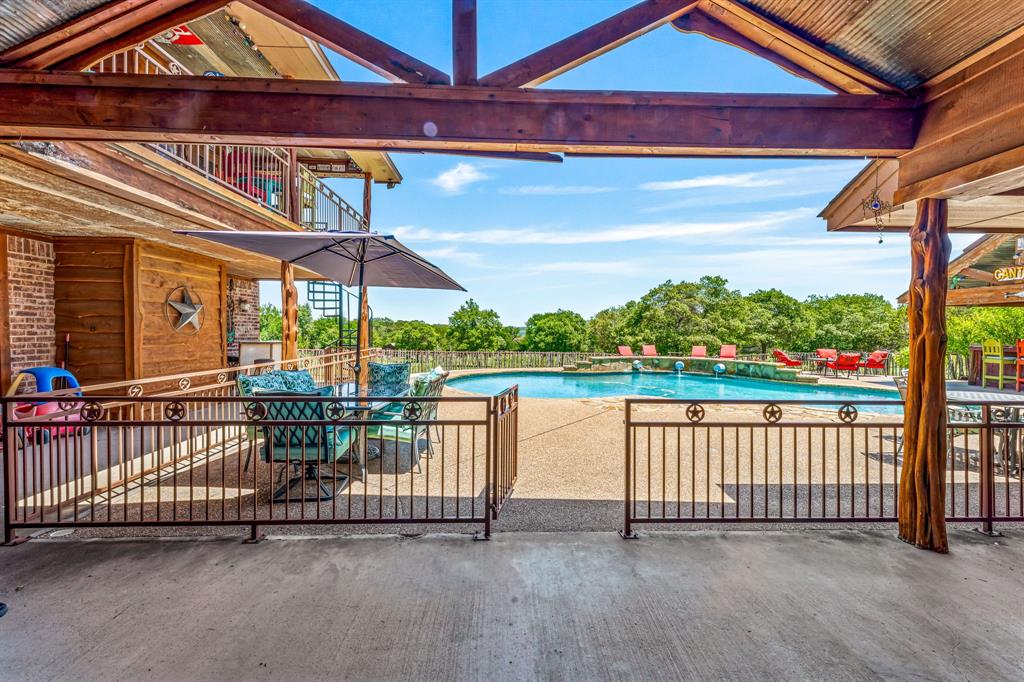 475 Magic Valley Bluff Dale, TX 76433 - Photo 7 of 40 a view of a balcony with lake and outdoor seating