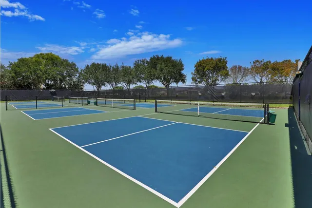 a view of an outdoor space and tennis court