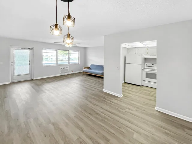 a view of a livingroom with wooden floor