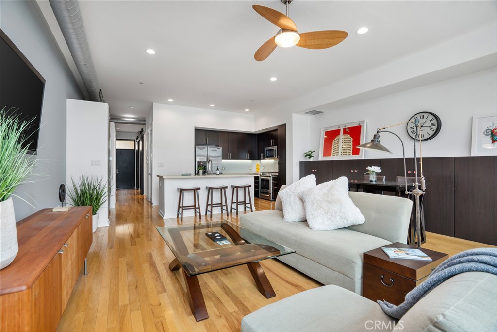 133 The Promenade North, Unit 422 Long Beach, CA 90802 - Photo 17 of 52 a living room with furniture kitchen view and a large window
