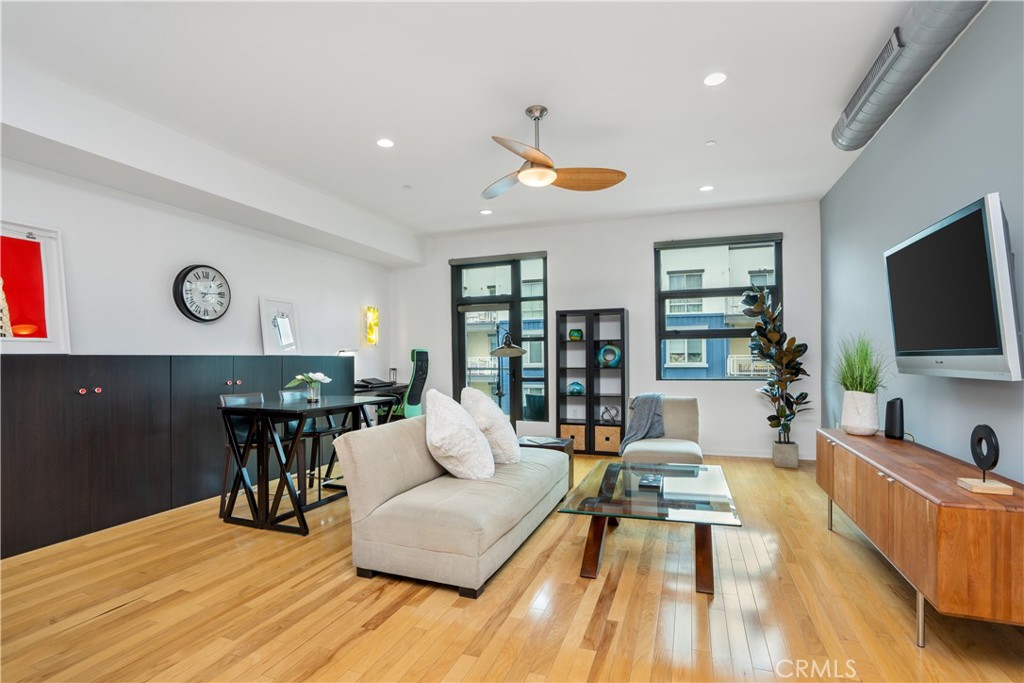 133 The Promenade North, Unit 422 Long Beach, CA 90802 - Photo 20 of 52 a living room with furniture and a flat screen tv