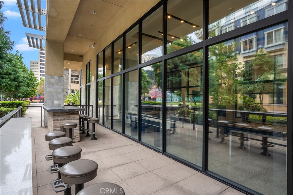 133 The Promenade North, Unit 422 Long Beach, CA 90802 - Photo 27 of 52 a balcony with chairs and with couches