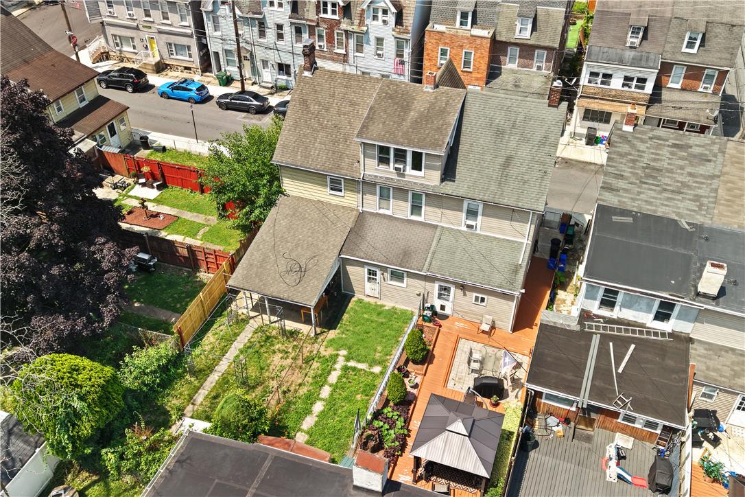 431 Pierce Street Bethlehem, PA 18015 - Photo 2 of 27 An aerial perspective reveals a cozy fenced yard and spacious rear deck, ideal for outdoor enjoyment.