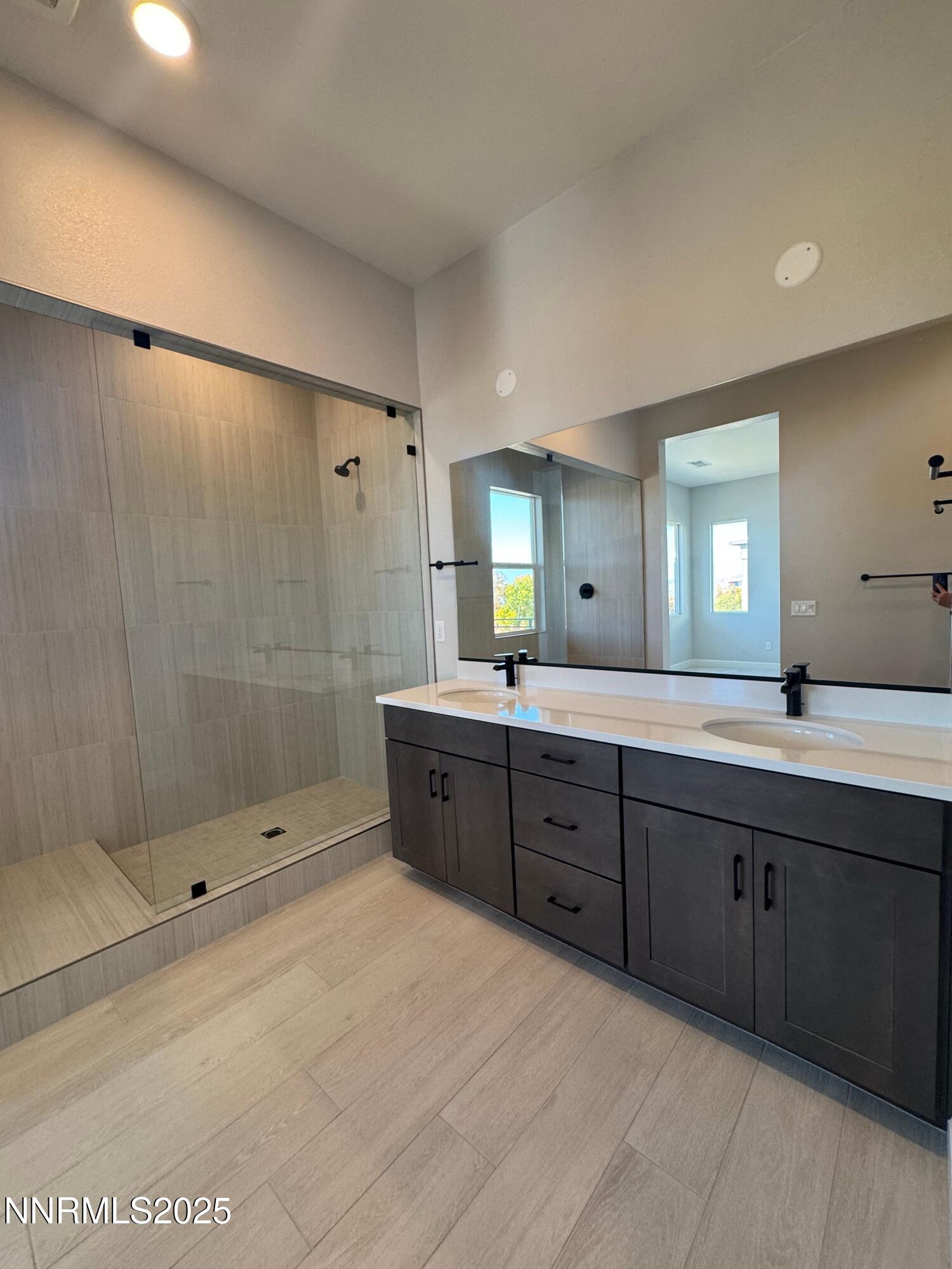 1521 Golf Club Drive Reno, NV 89519 - Photo 20 of 38 a spacious bathroom with a shower sink mirror and