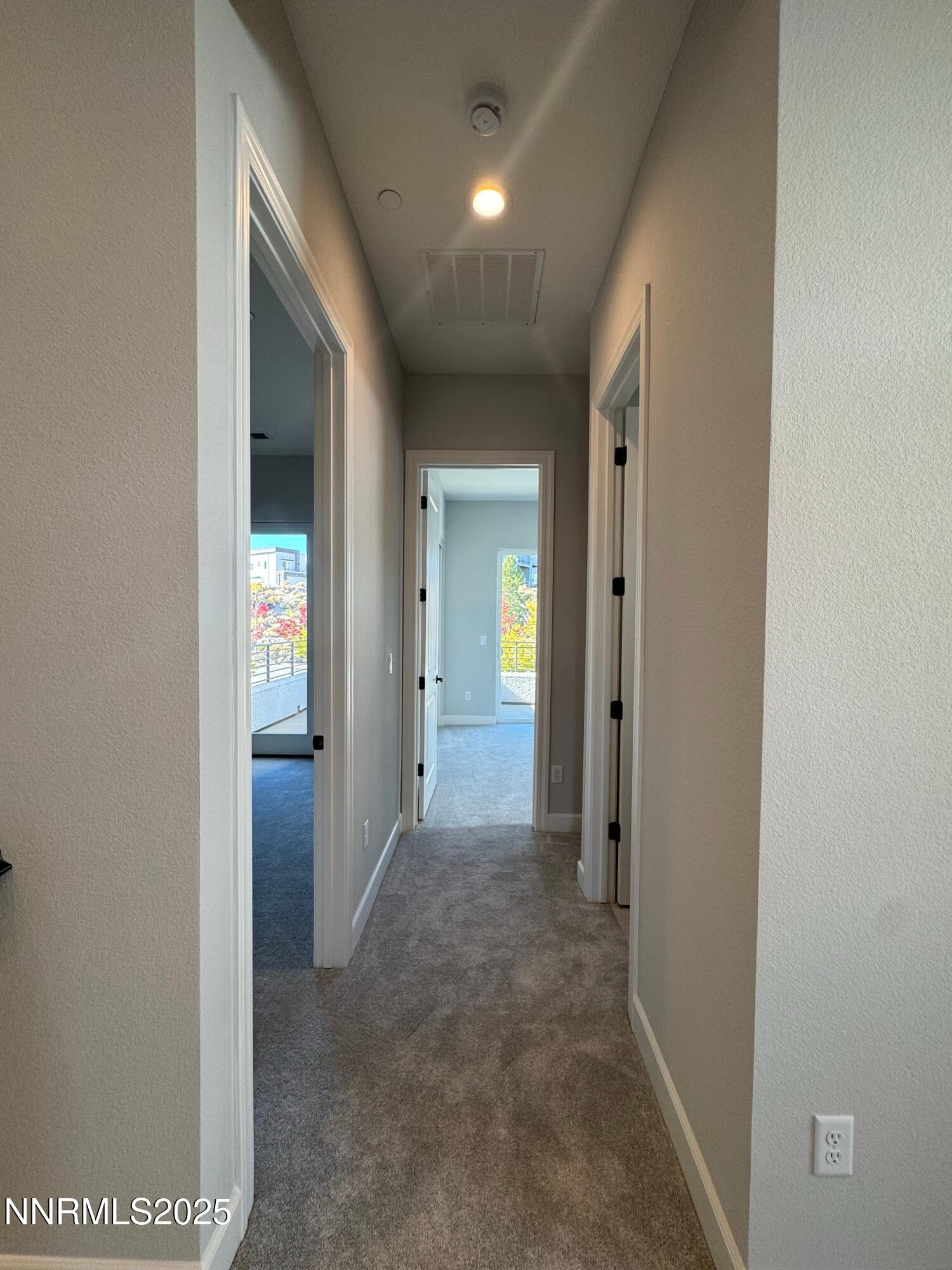 1521 Golf Club Drive Reno, NV 89519 - Photo 26 of 38 a view of a hallway with wooden shelves