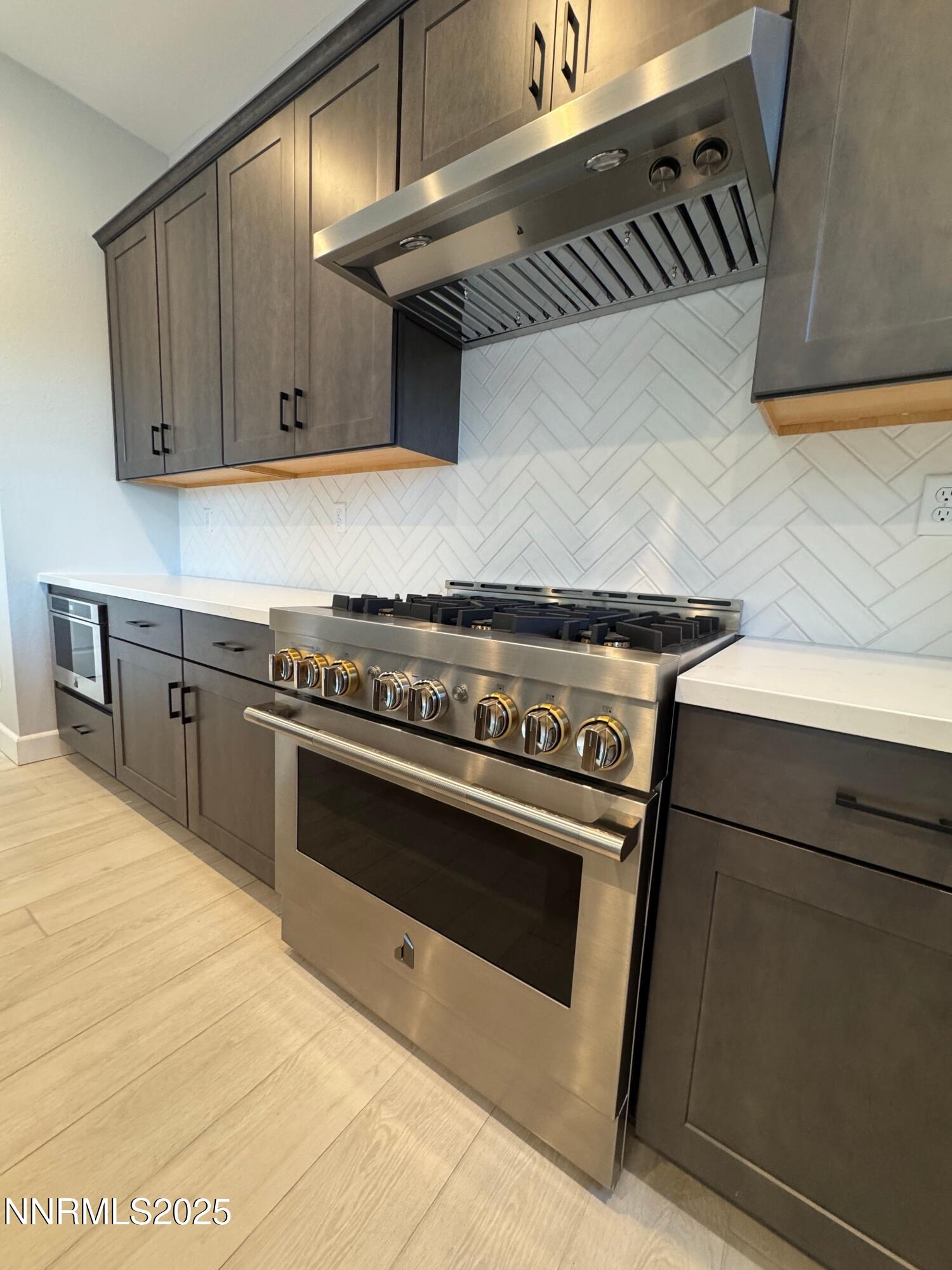 1521 Golf Club Drive Reno, NV 89519 - Photo 5 of 38 a stove top oven sitting inside of a kitchen