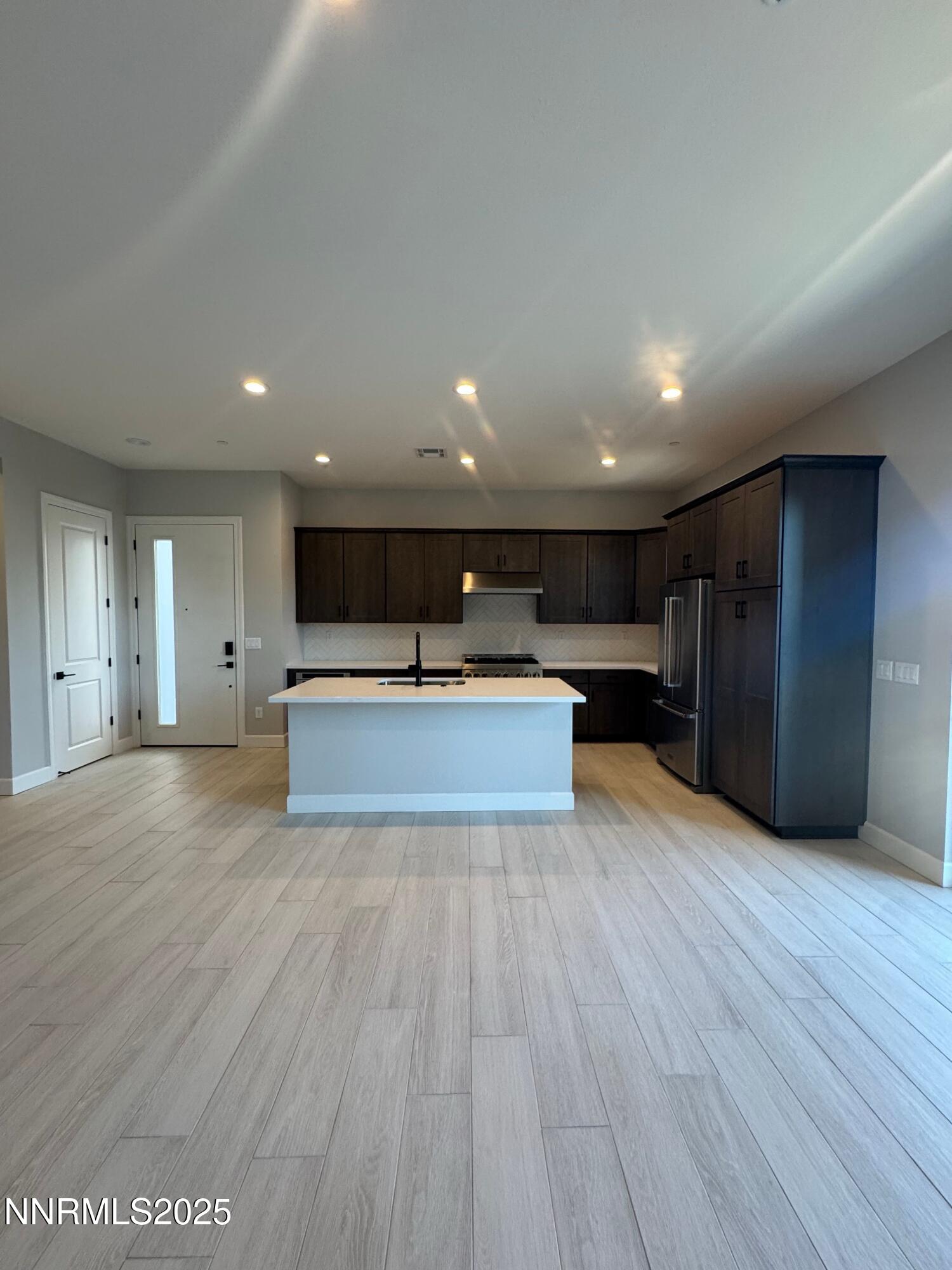1521 Golf Club Drive Reno, NV 89519 - Photo 8 of 38 a view of an empty room with wooden floor