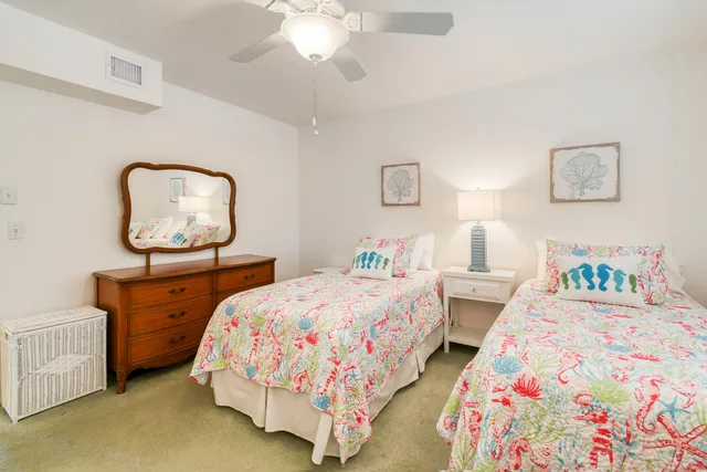 a bedroom with bed and a dresser