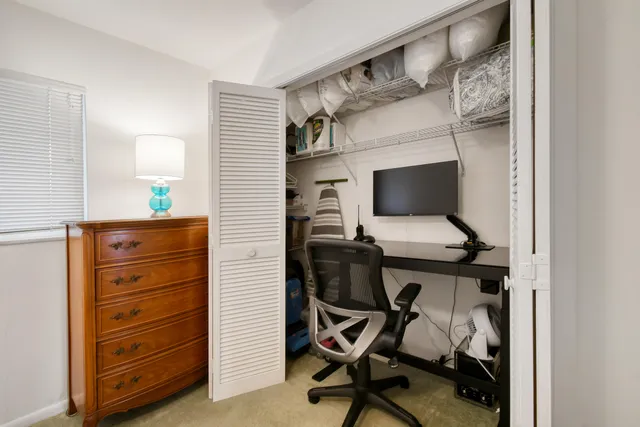 a view of a workspace with furniture