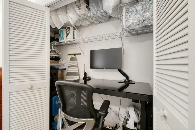 a view of a workspace with furniture