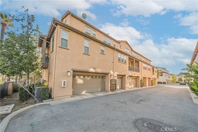 a view of a house with a street