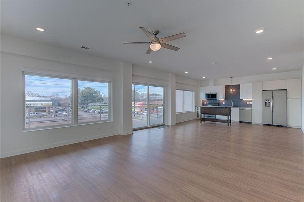 4361 South Congress Avenue, Unit 210 Austin, TX 78745 - Photo 30 of 30 a view of a livingroom with furniture wooden floor and window