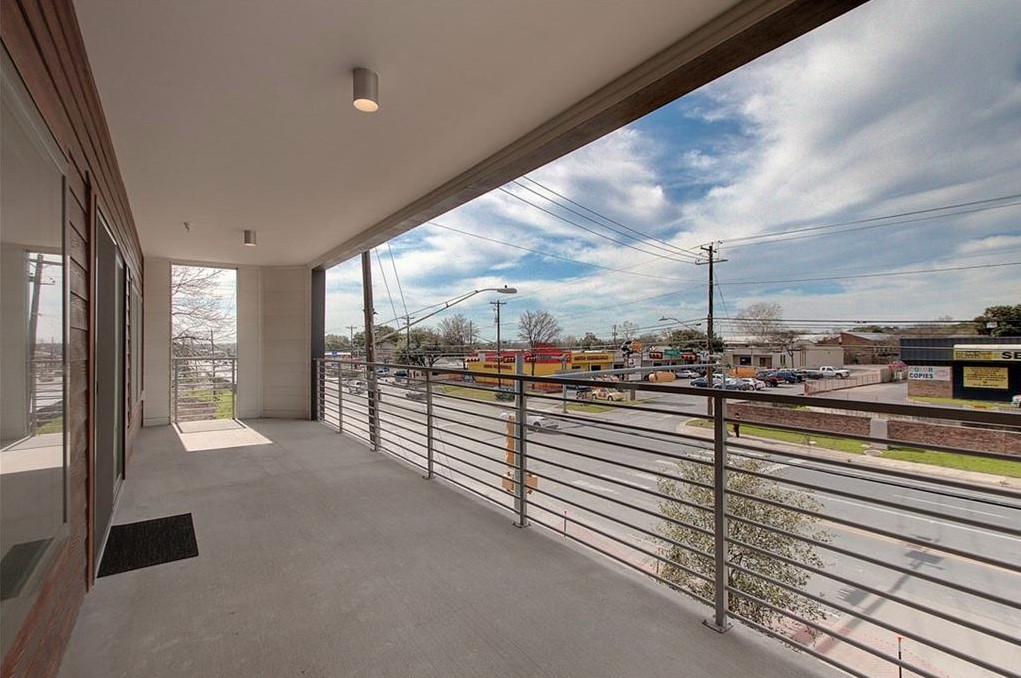 4361 South Congress Avenue, Unit 210 Austin, TX 78745 - Photo 20 of 30 a view of a floor and chair in the balcony