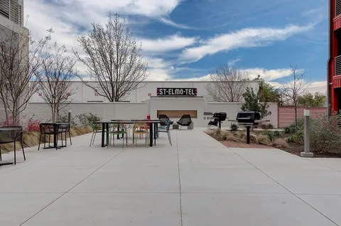 a view of a building with a yard