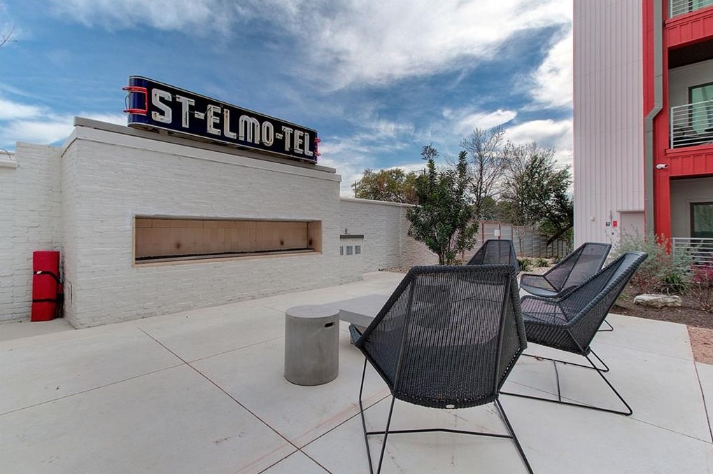 4361 South Congress Avenue, Unit 210 Austin, TX 78745 - Photo 25 of 30 a view of a chairs and table in the back yard of the building