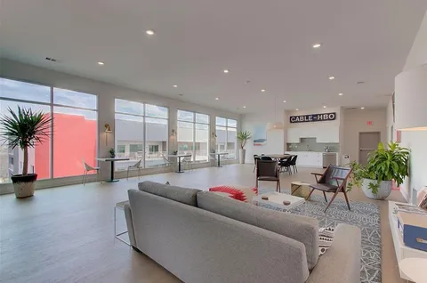 a living room with furniture and a table