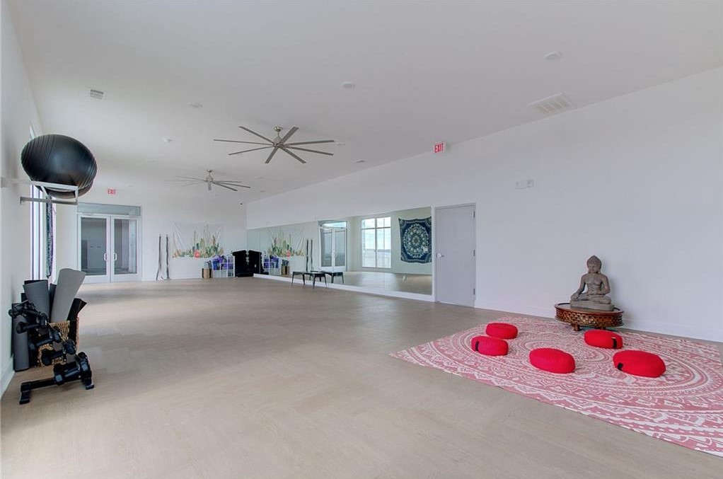 4361 South Congress Avenue, Unit 210 Austin, TX 78745 - Photo 29 of 30 a very nice looking room with a chair and white walls