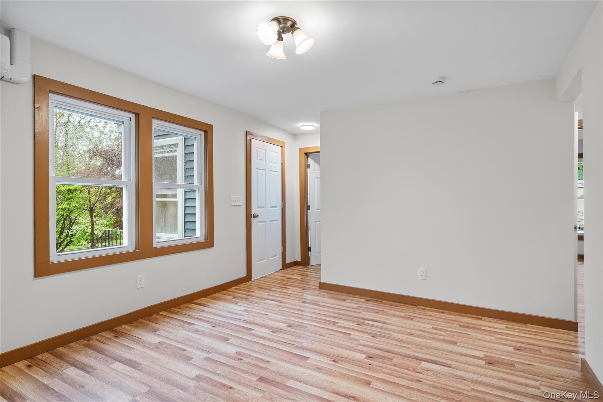 15 Riley Road New Windsor, NY 12553 - Photo 11 of 33 a view of an empty room with wooden floor and a window