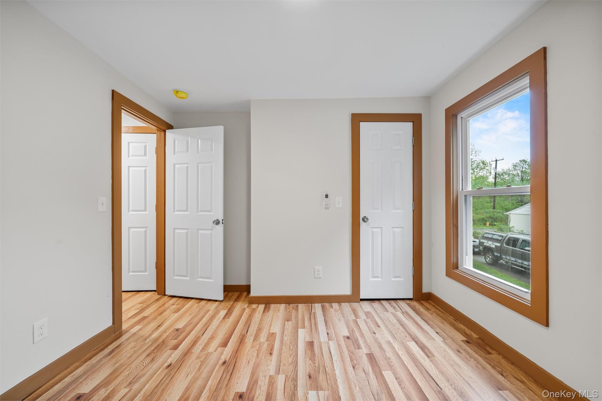 15 Riley Road New Windsor, NY 12553 - Photo 12 of 33 a view of an empty room with wooden floor and a window