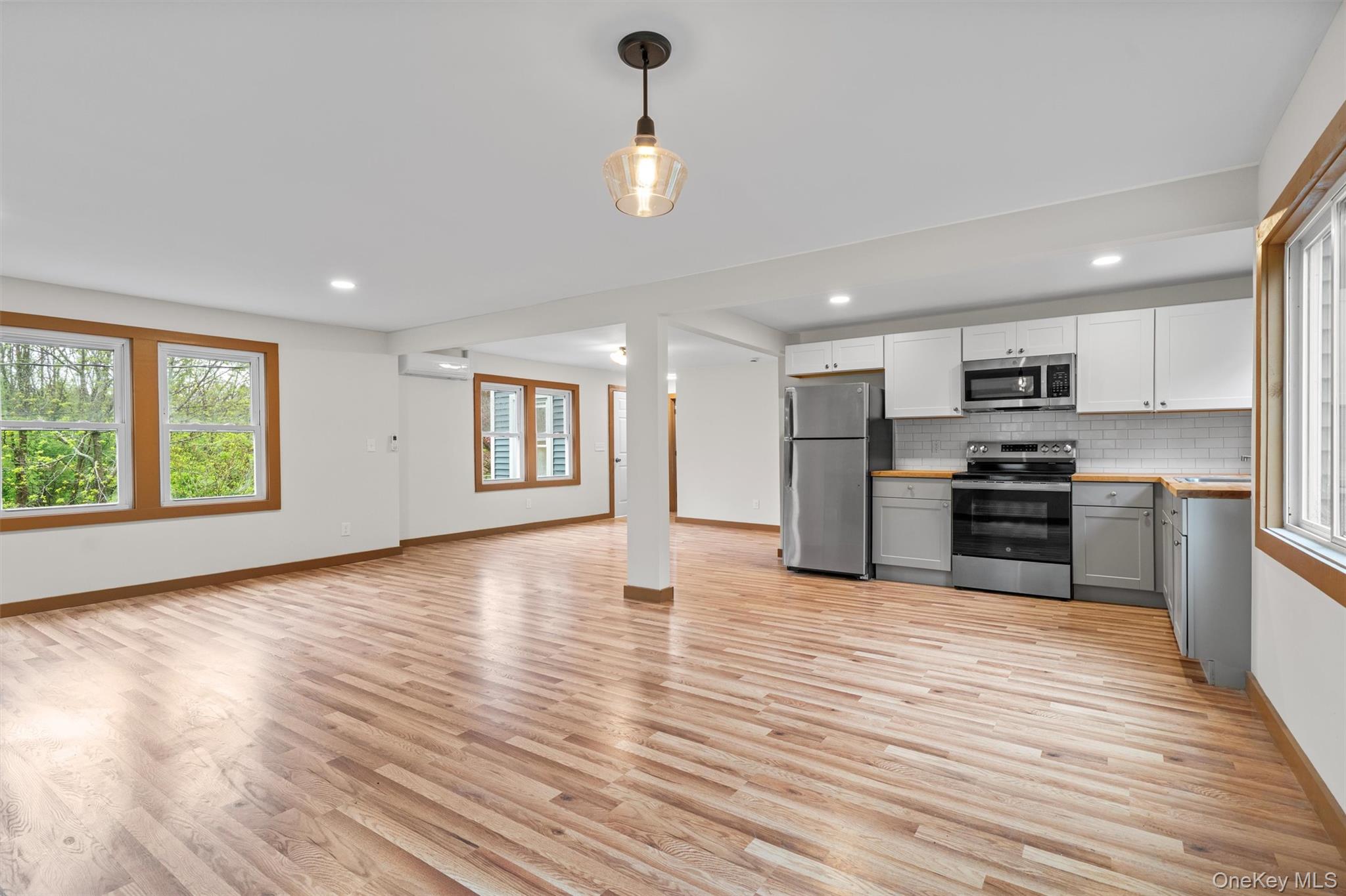 15 Riley Road New Windsor, NY 12553 - Photo 30 of 33 a kitchen with stainless steel appliances granite countertop a stove and a wooden floors