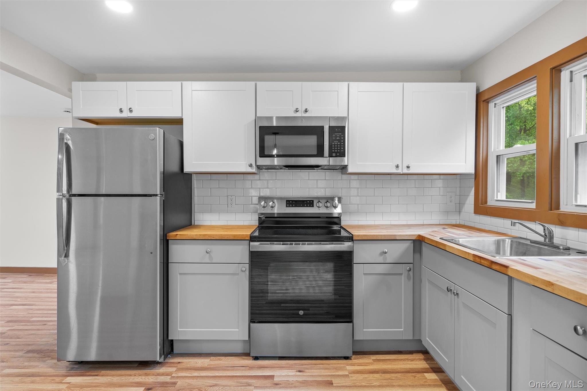 15 Riley Road New Windsor, NY 12553 - Photo 14 of 33 a kitchen with appliances cabinets and a sink