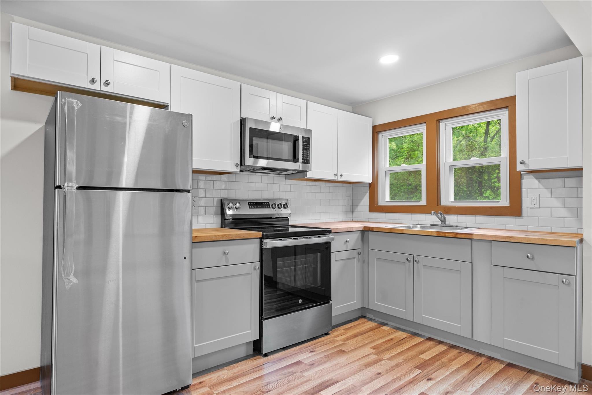 15 Riley Road New Windsor, NY 12553 - Photo 15 of 33 a kitchen with stainless steel appliances a refrigerator sink and microwave