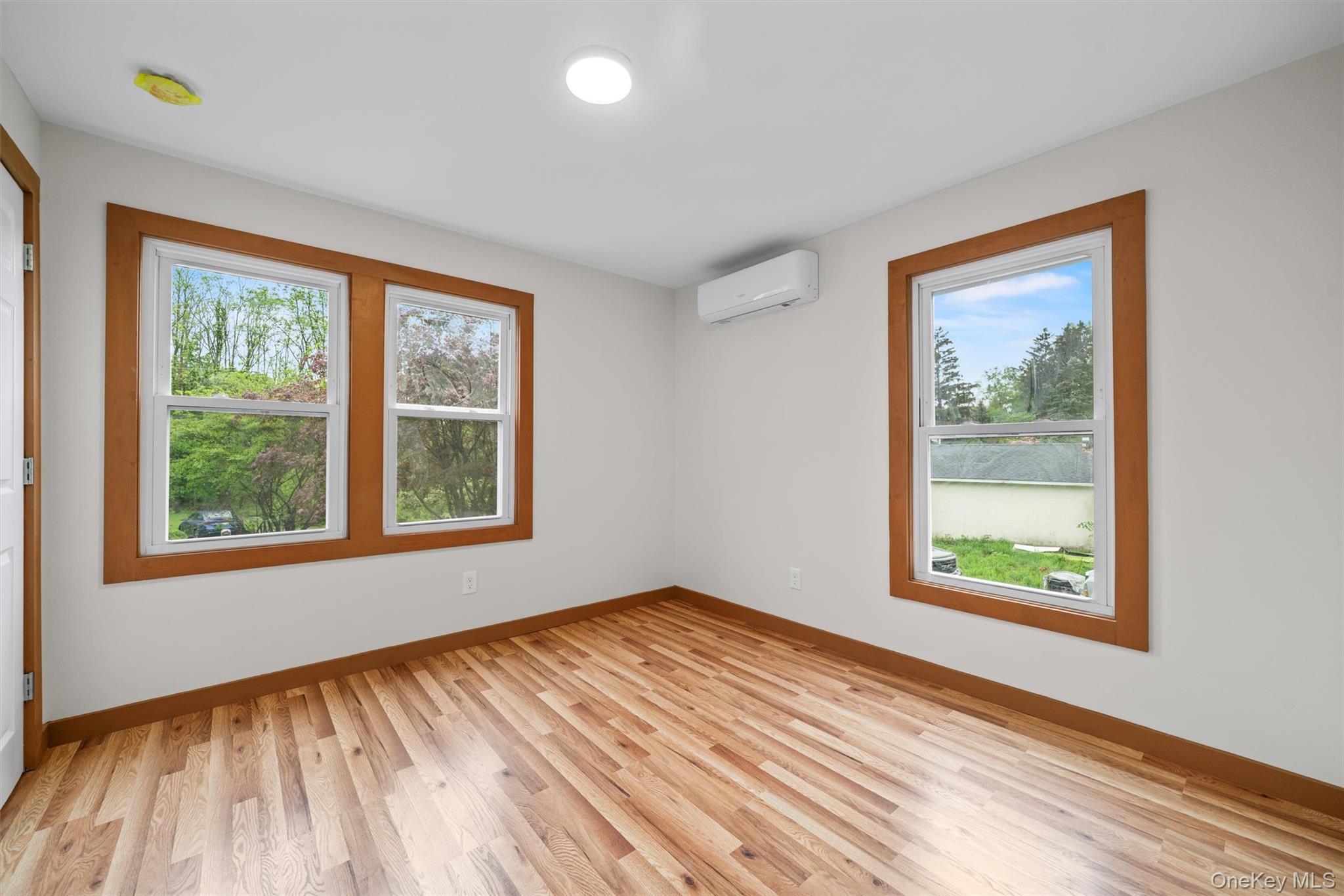 15 Riley Road New Windsor, NY 12553 - Photo 18 of 33 a view of an empty room with wooden floor and a window