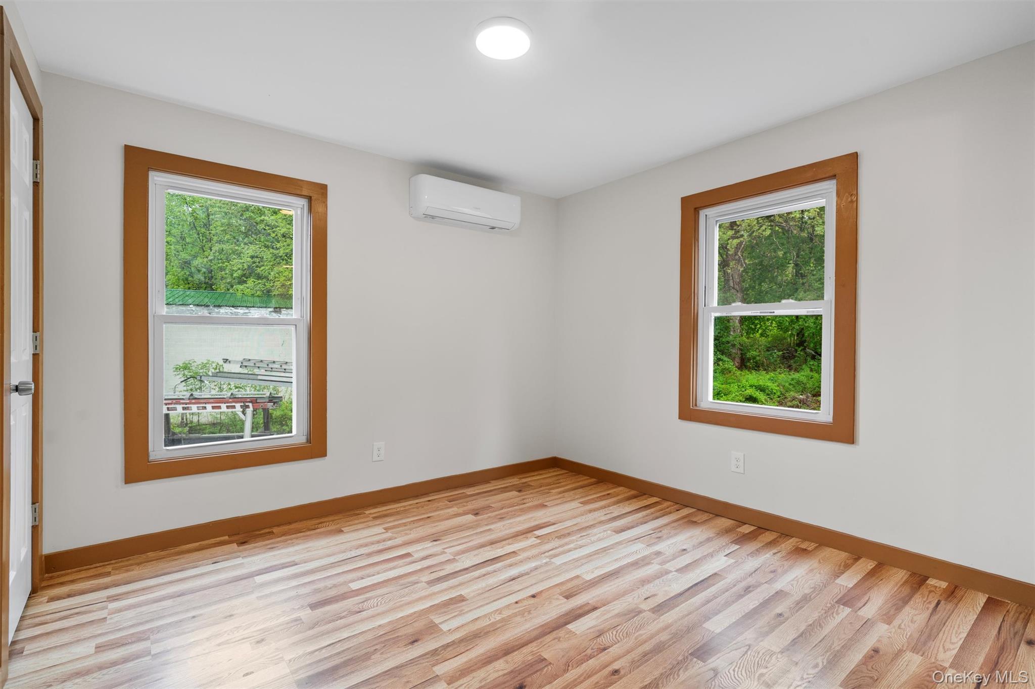 15 Riley Road New Windsor, NY 12553 - Photo 19 of 33 a view of an empty room with wooden floor and a window