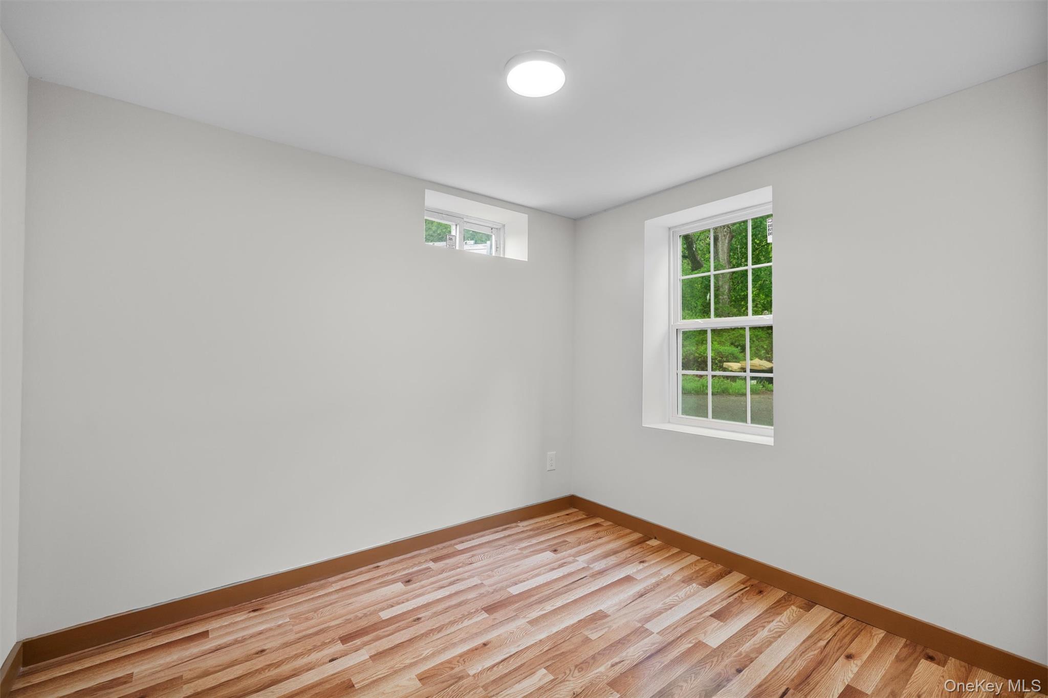 15 Riley Road New Windsor, NY 12553 - Photo 24 of 33 an empty room with wooden floor and windows