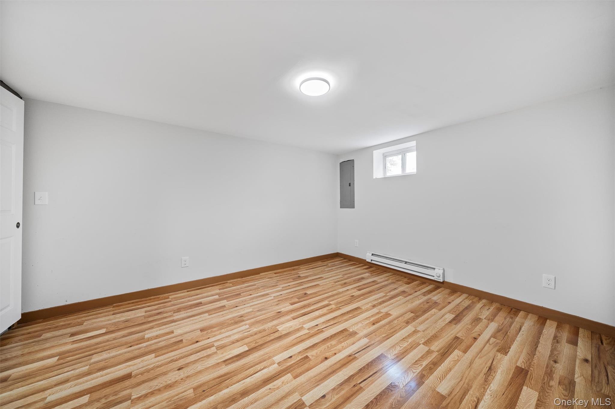 15 Riley Road New Windsor, NY 12553 - Photo 25 of 33 a view of an empty room with wooden floor and a window