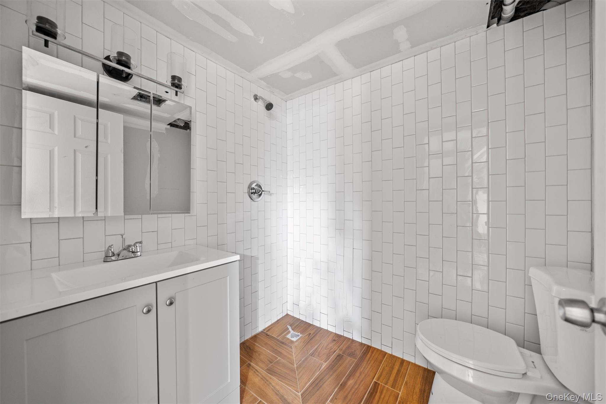 15 Riley Road New Windsor, NY 12553 - Photo 26 of 33 a bathroom with a sink a toilet and shower