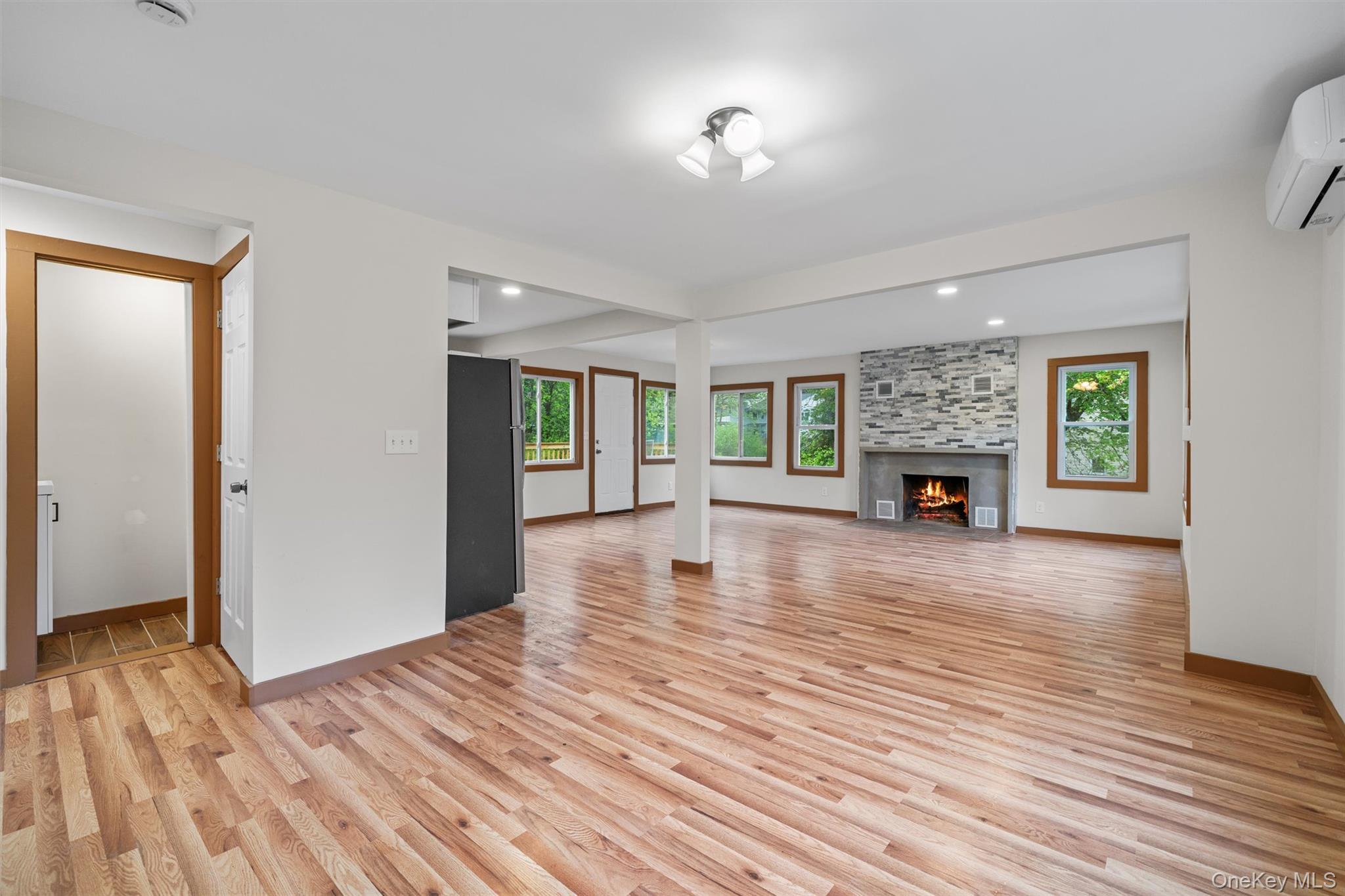 15 Riley Road New Windsor, NY 12553 - Photo 6 of 33 a view of empty room with wooden floor and fireplace