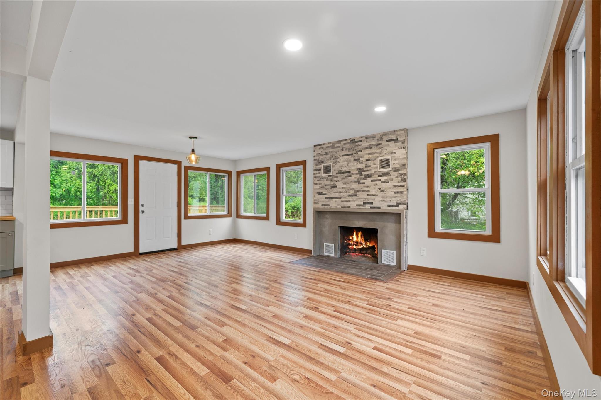 15 Riley Road New Windsor, NY 12553 - Photo 7 of 33 an empty room with windows and fireplace