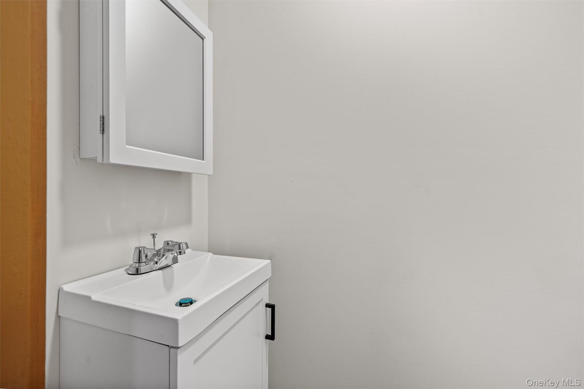 15 Riley Road New Windsor, NY 12553 - Photo 9 of 33 a bathroom with a sink and a mirror