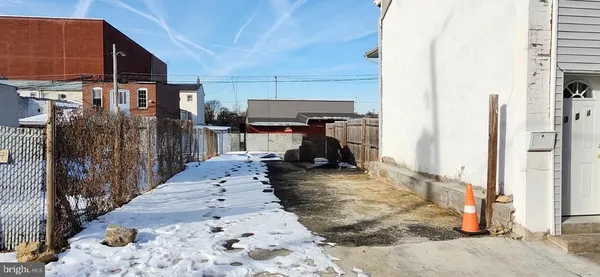 a view of a living room and a refrigerator in the house