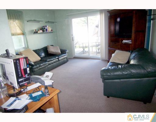 29 Brookville Road Edison, NJ 08817 - Photo 5 of 10 a living room with furniture and a window