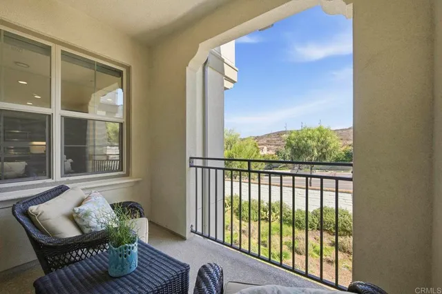 a view of porch with furniture and windows