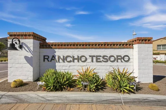 a view of a sign board with parking space
