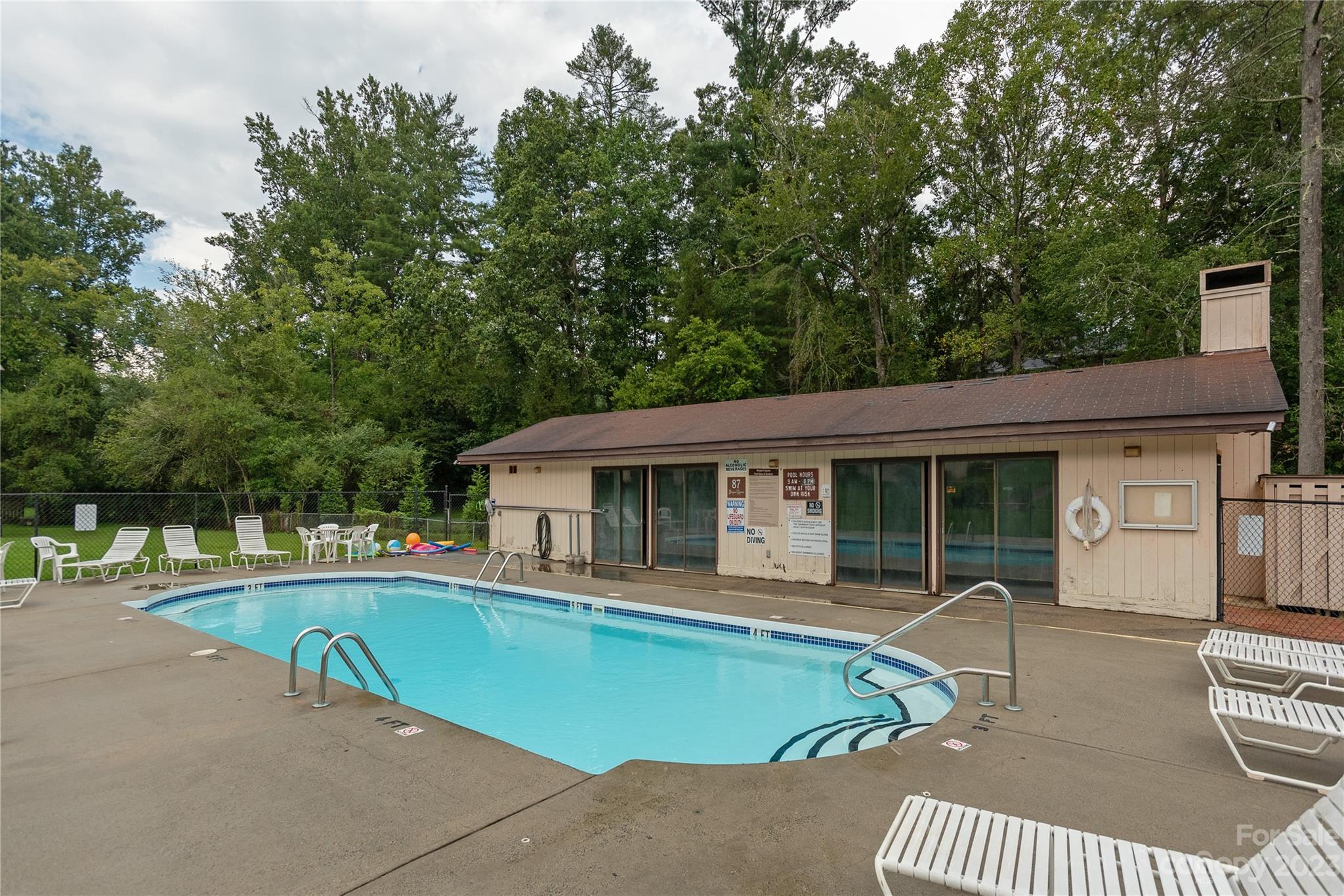 111 Shepard Square, Unit 608 Brevard, NC 28712 - Photo 13 of 13 a view of a house with pool and chairs