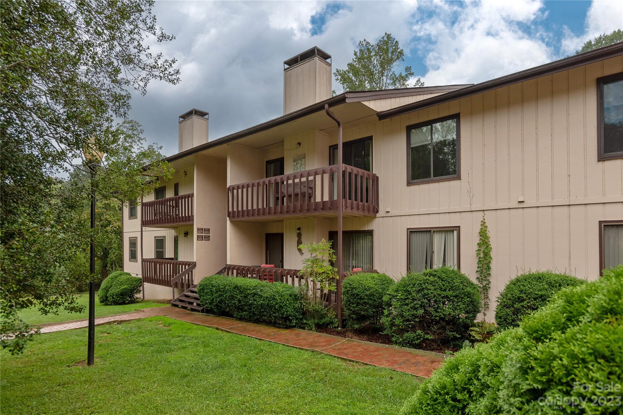 111 Shepard Square, Unit 608 Brevard, NC 28712 - Photo 2 of 13 a view of a yard in front of house