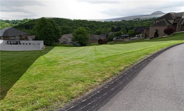 a view of a garden with a building in the background