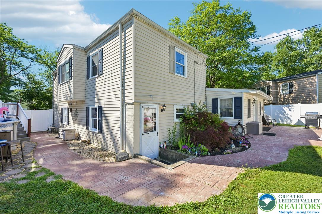 2649 Nottingham Road Bethlehem, PA 18017 - Photo 36 of 49 A quaint backyard patio offers ample space for outdoor entertaining, surrounded by established greenery and mature trees.