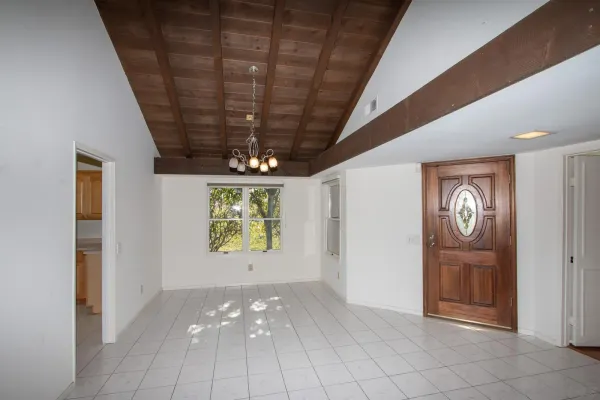 a view of an empty room with windows