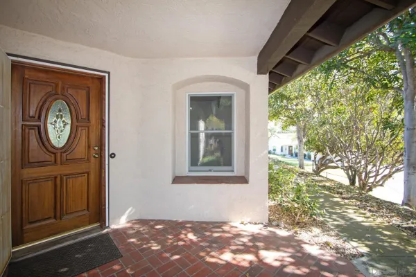 a view of a door and wooden floor