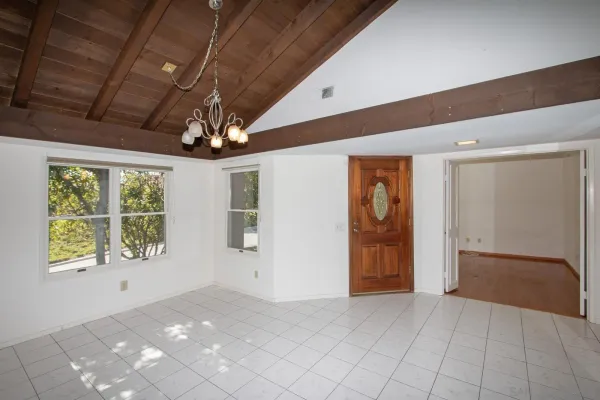 a view of an empty room with a window