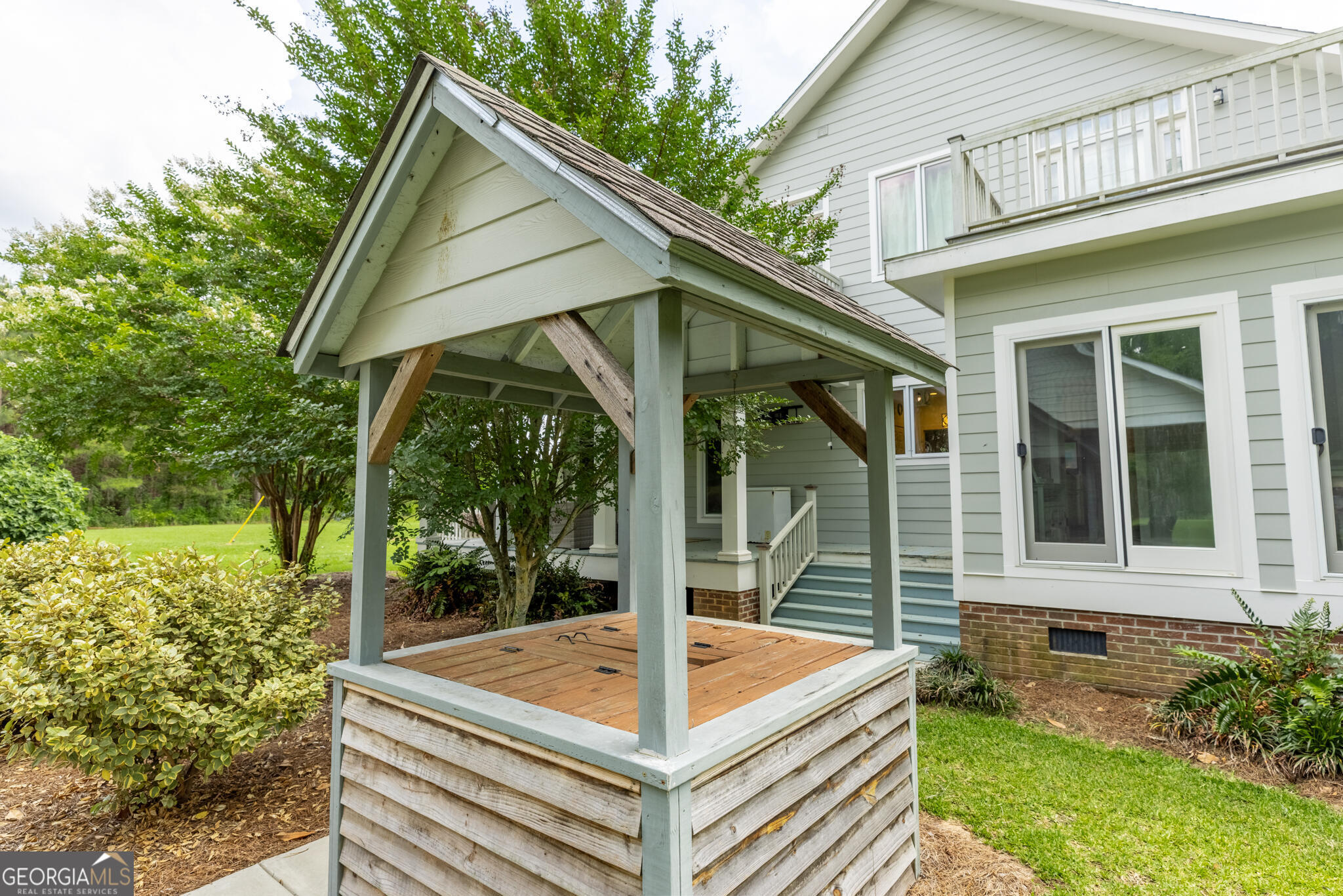 1859 Upper River Road Americus, GA 31709 - Photo 13 of 47 a view of house with backyard and a porch