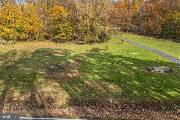 a view of a yard with an outdoor space
