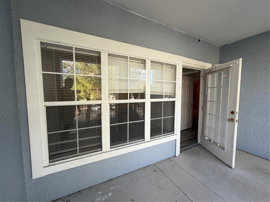 3561 Conroy Road, Unit 225 Orlando, FL 32839 - Photo 8 of 14 a view of empty room with windows
